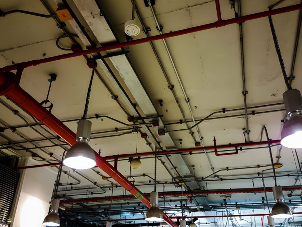 Overhead sprinkler system in large warehouse.