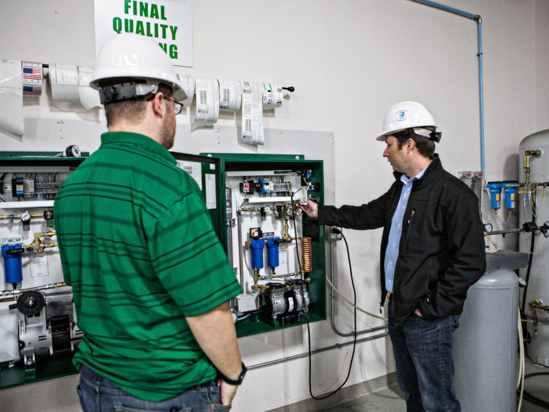 workers-showing-fire-sprinkler-monitoring-system