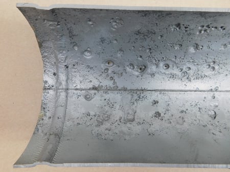 Localized corrosion in a galvanized pipe sample