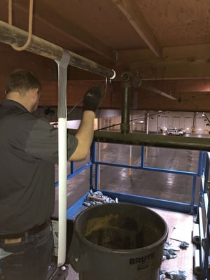 An ECS engineer performing a Corrosion Assessment on-site at facility