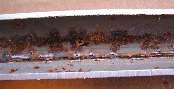 Close Up of Acid Corrosion in Fire Sprinkler Pipe