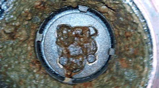condensate corrosion on underside of clapper